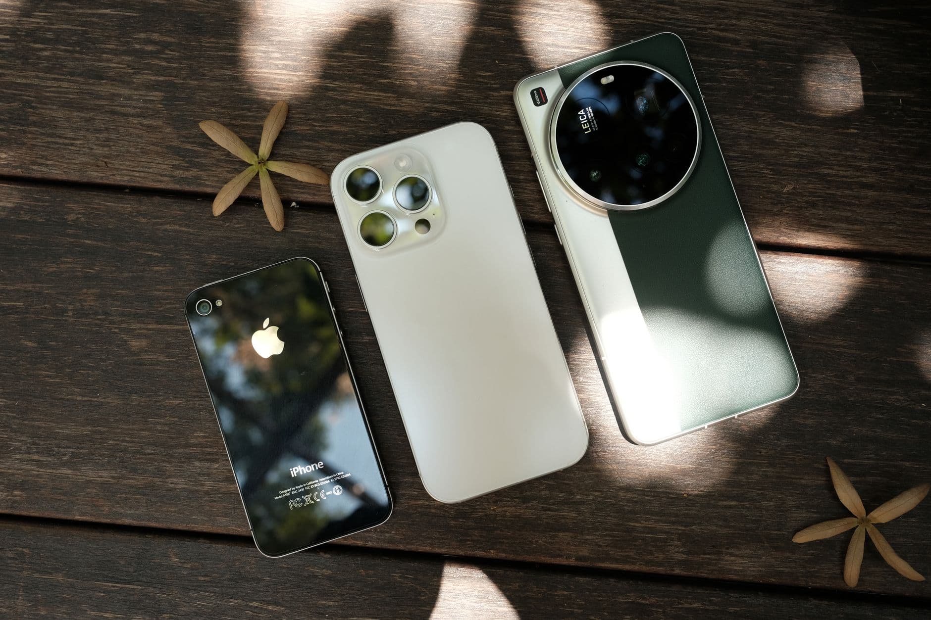 An iPhone lying beside an Android phone on a table