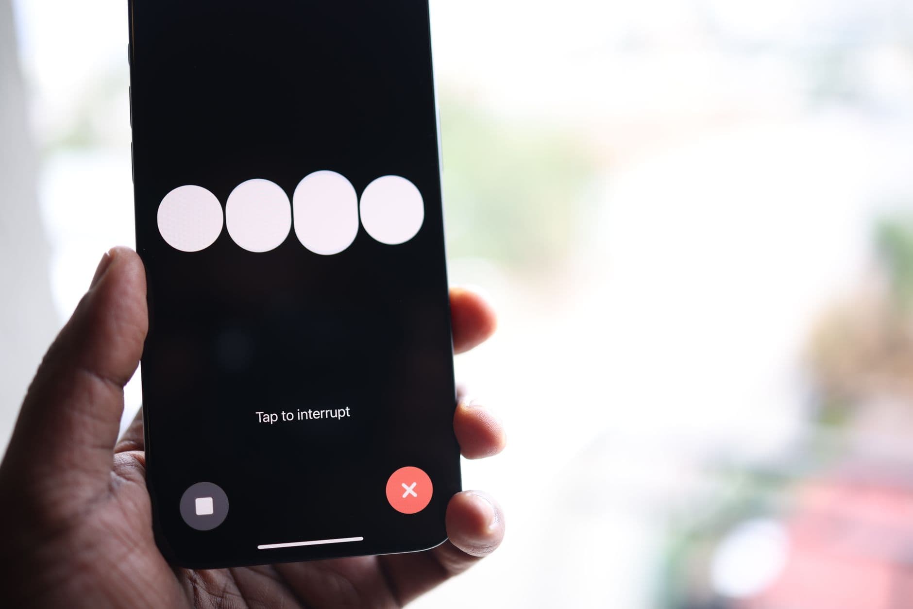 A finger tapping a setting on a phone screen