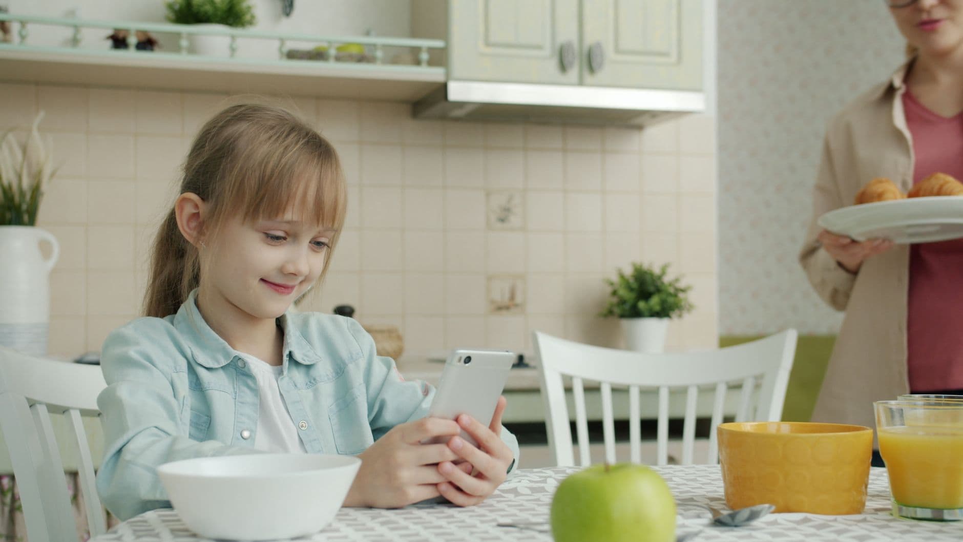 A smartphone ringing on a kitchen table