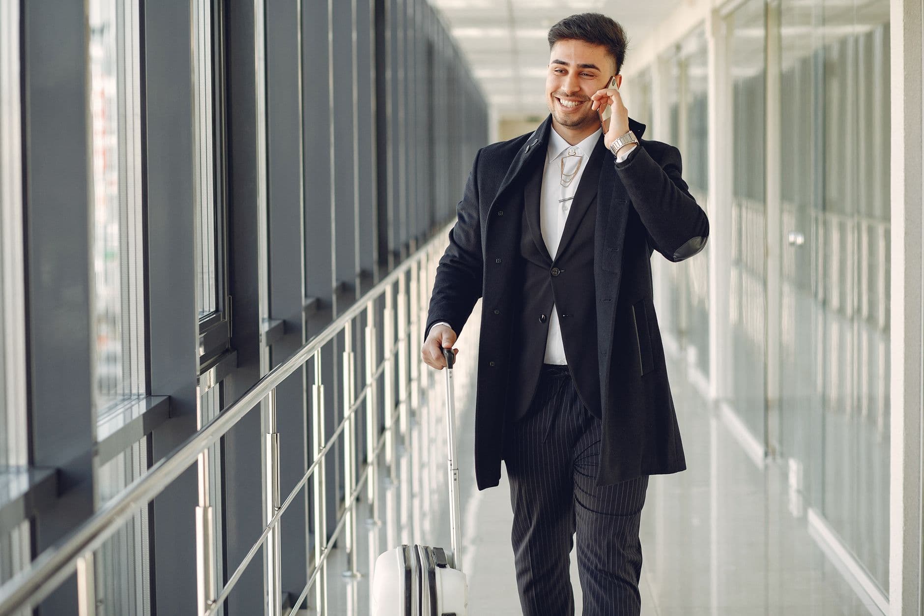 Someone answering a phone call in a hallway