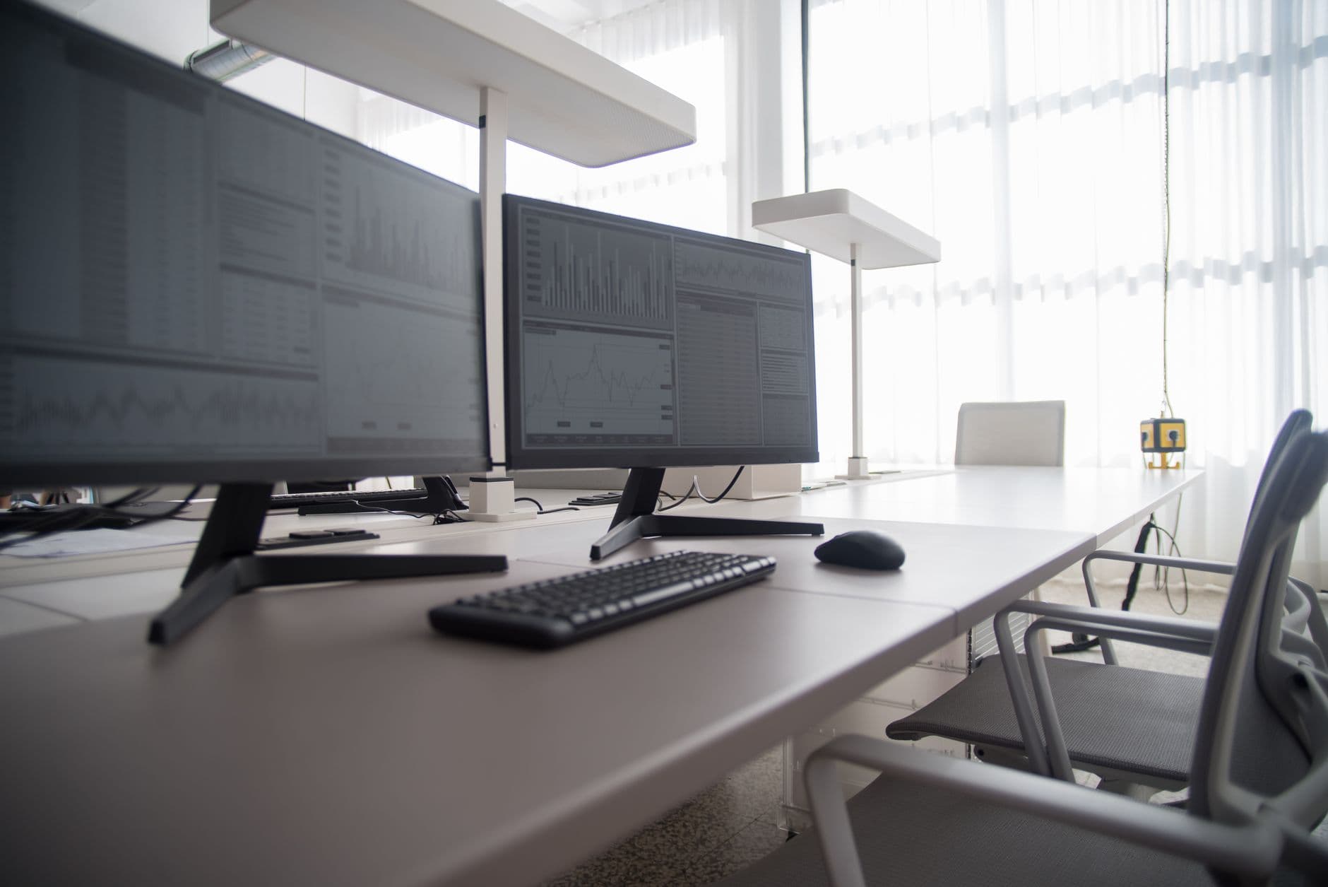 A computer monitor showing a weekly schedule in an office