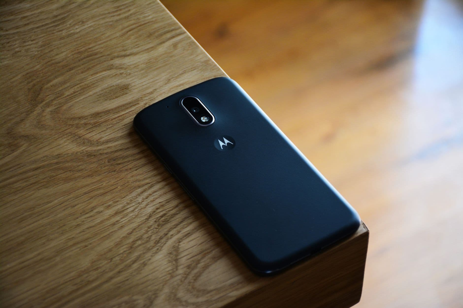 A smartphone screen lighting up on a desk