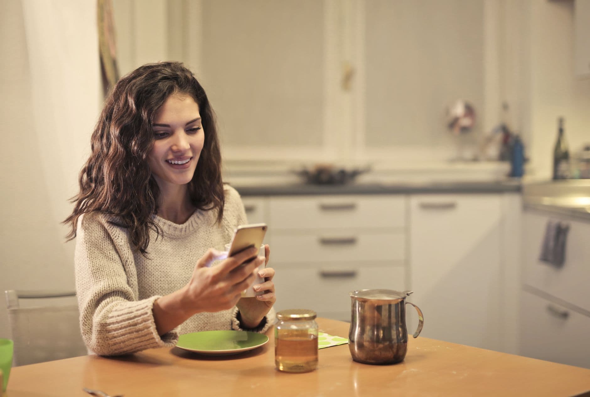 A smartphone showing a checklist in a kitchen