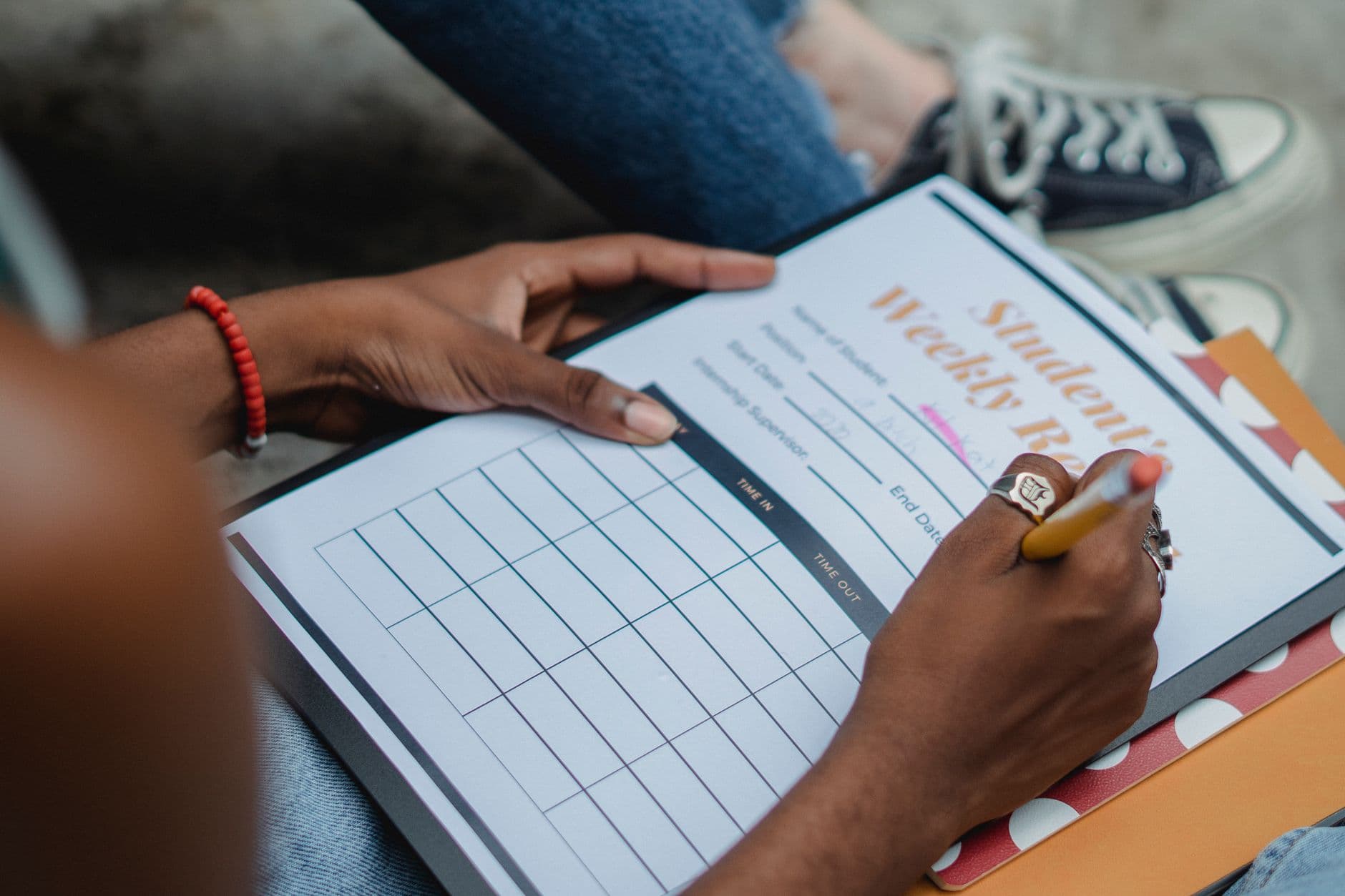 A weekly timetable planner laid out on a desk