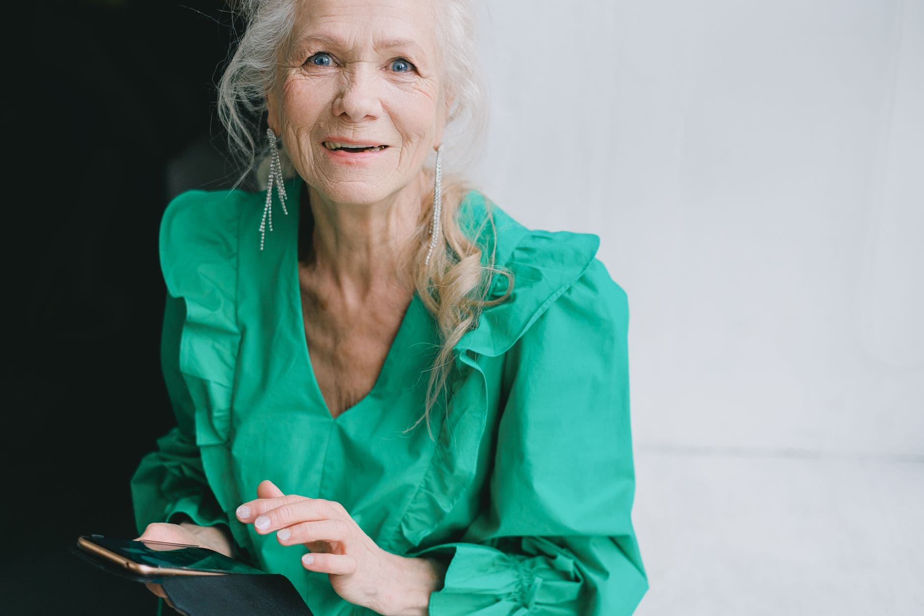 A senior woman taking a phone call at home